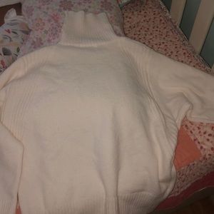 Turtle neck sweater never worn. Cream color
